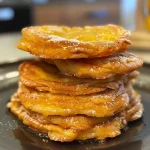 ['Close-up of soft pumpkin spice cookies with a golden-brown exterior.', 'Side view of fluffy pumpkin spice cookies, showcasing their puffy texture.', 'A detailed look at delicious pumpkin spice cookies, highlighting their warm color.', 'Juicy pumpkin spice cookies stacked, displaying their inviting softness.']