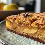 ['Close-up side view of a freshly baked almond flour apple cake, showing the apple slices on top.', 'A delicious almond flour apple cake with a moist texture and visible apple pieces, photographed from the side.', 'Side view of a juicy almond flour apple cake, highlighting the golden crust and glistening apple slices.', 'Appetizing almond flour apple cake displayed in a close-up shot, showcasing its rich color and texture.']