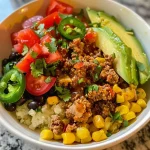 ['Close-up view of a turkey burrito meal prep bowl featuring ground turkey, corn, and black beans.', 'Side angle of a colorful turkey burrito bowl filled with cauliflower rice and topped with fresh veggies.', 'Juicy turkey burrito bowl showcasing layered ingredients like chopped tomatoes and avocado.', 'Vibrant turkey burrito meal prep bowl with a variety of toppings, including cheese and cilantro.']