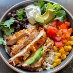 ['Close-up of a colorful chicken burrito bowl featuring diced chicken, rice, beans, and toppings.', 'Side view of a zesty chicken burrito bowl with vibrant ingredients including avocado and cilantro.', 'Juicy burrito bowl filled with chicken, corn, peppers, and garnished with cheese and sour cream.', 'Delicious chicken burrito bowl showcasing layers of rice, beans, and fresh toppings in a single pan.']