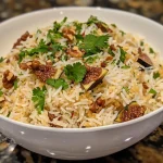 Close-up image of Fig & Walnut Pasta Rice Pilaf with vibrant colors and textures.