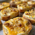 Close-up view of a three cheese ball garnished with chopped nuts.