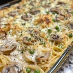 Close-up view of a serving of Turkey Tetrazzini with creamy sauce and pasta.